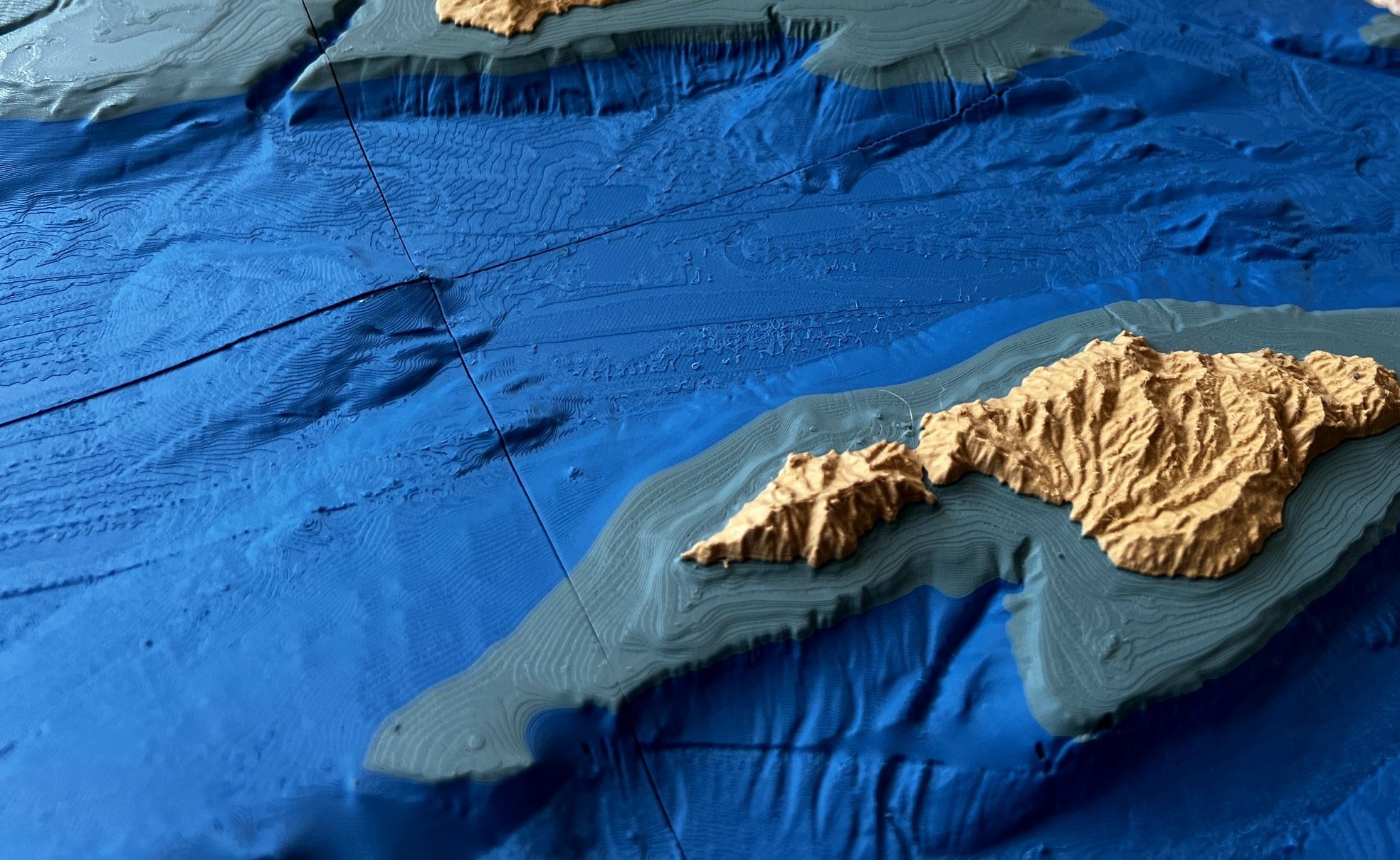 Raking light across the Channel Islands large-format relief